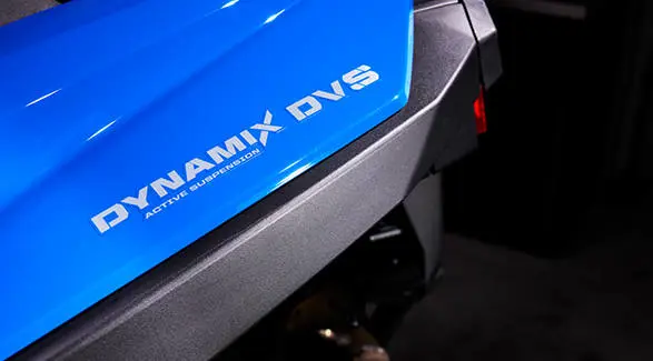 Graphic detail showing the DYNAMIX DVS ACTIVE SUSPENSION decal on the blue bodywork.