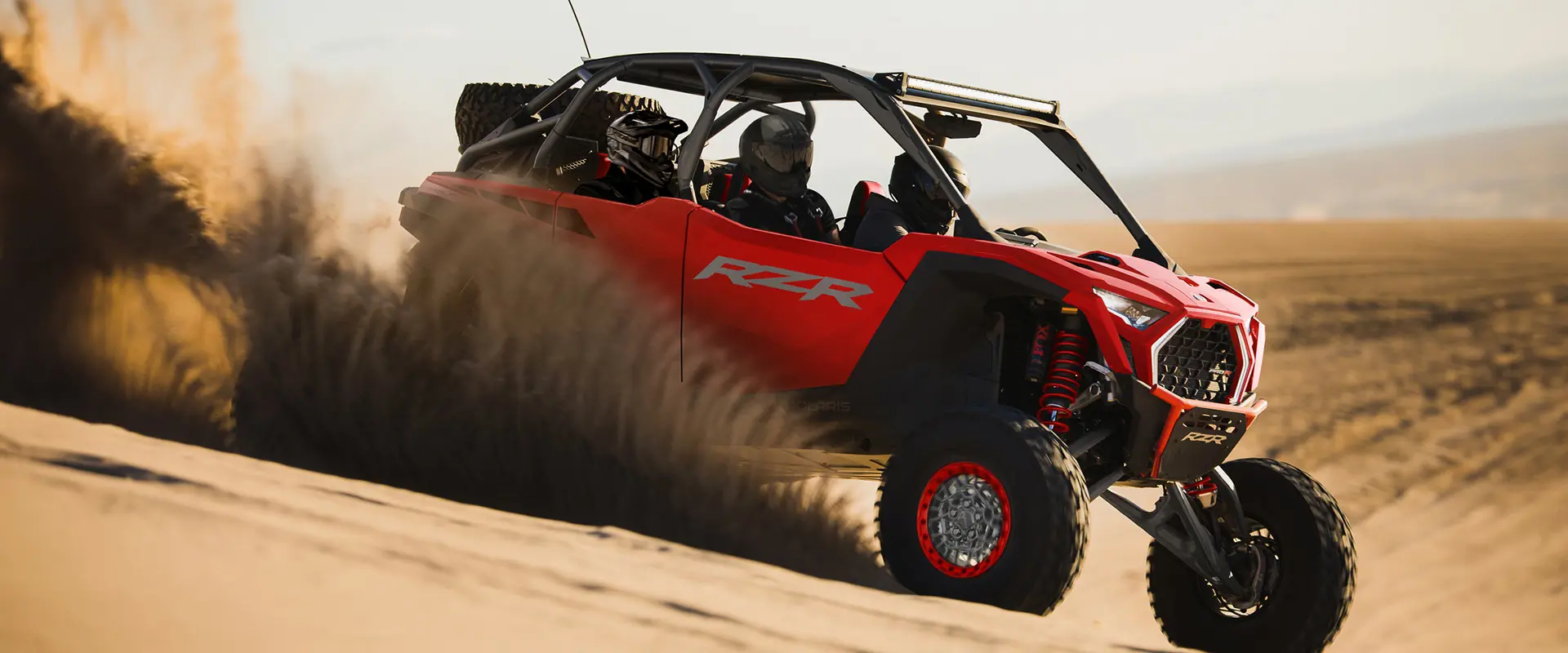 4 riders in a 2026 Polaris RZR Pro R 4 SxS cruising through the desert.