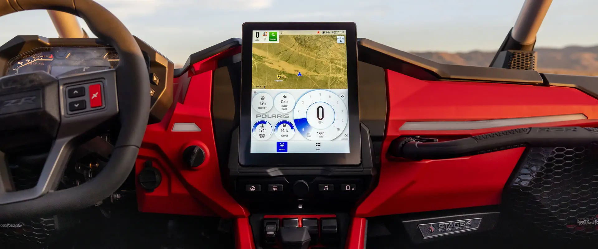 Closeup of the interior dash and touch screen in a 2026 Polaris RZR Pro R SxS.