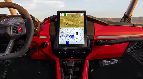 Closeup of the interior dash and touch screen in a 2026 Polaris RZR Pro R SxS.