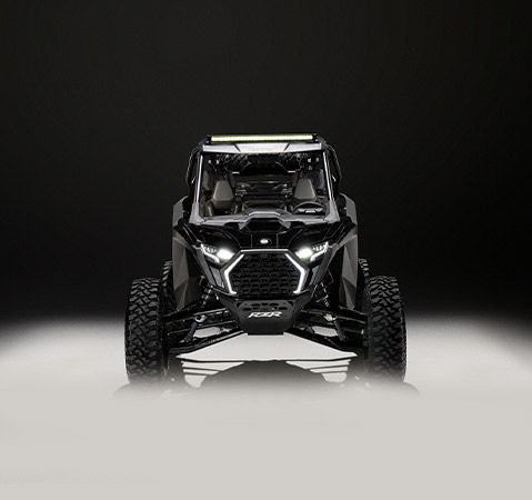 Front-end view of a 2026 Polaris RZR Pro S side-by-side showcasing the RZR Fang Lighting. 