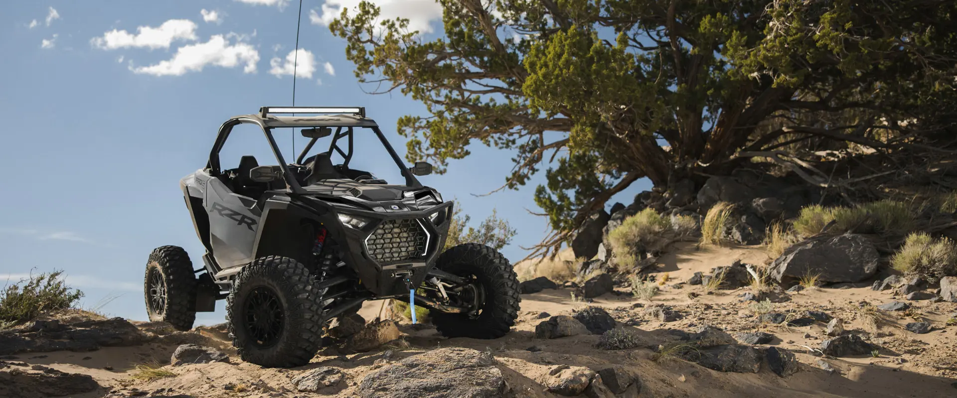 2026 Polaris RZR Pro S Ultimate SxS in Slate Gray parked on sandy/rocky terrain.