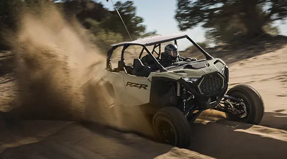 A 2026 Polaris RZR Pro S 4 Ultimate SxS throwing sand in a groove on a trail.
