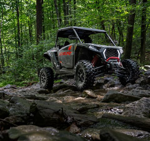 A 2026 Polaris RZR XP Ultimate side-by-side handling rocky terrain like a champ.