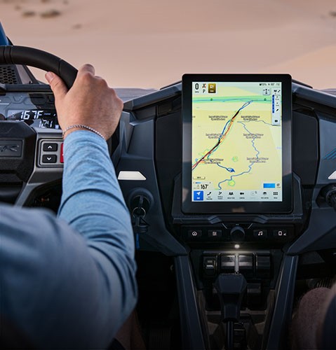 Interior view of the technology and touch screen display in a Polaris RZR sport side-by-side.