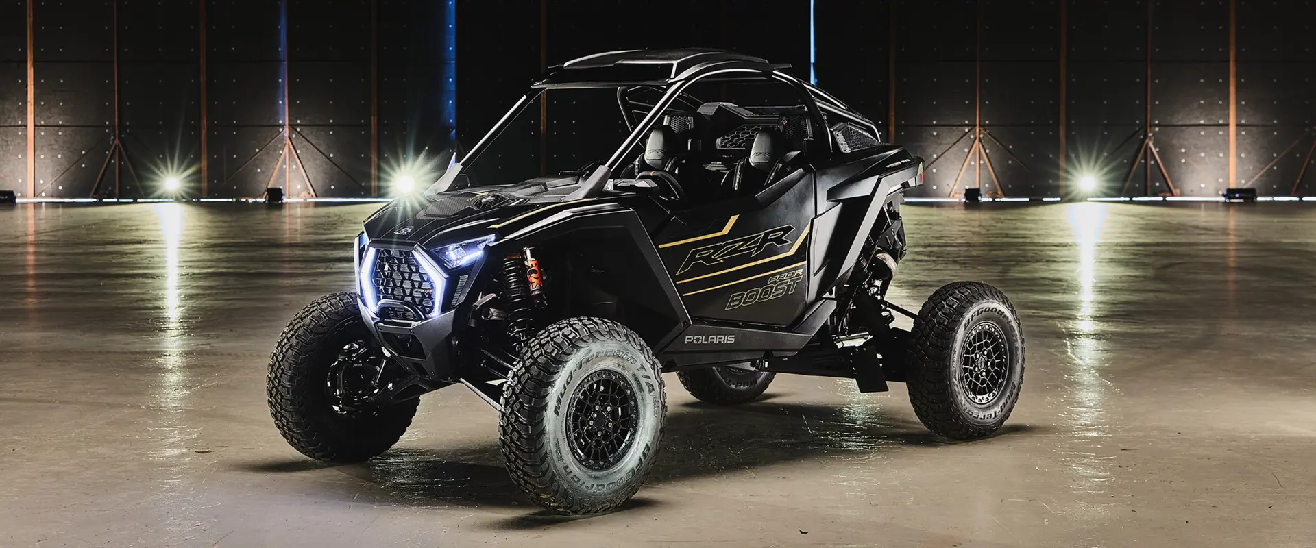 Side profile of a 2027 Polaris RZR Pro R Boost Ultra side-by-side.