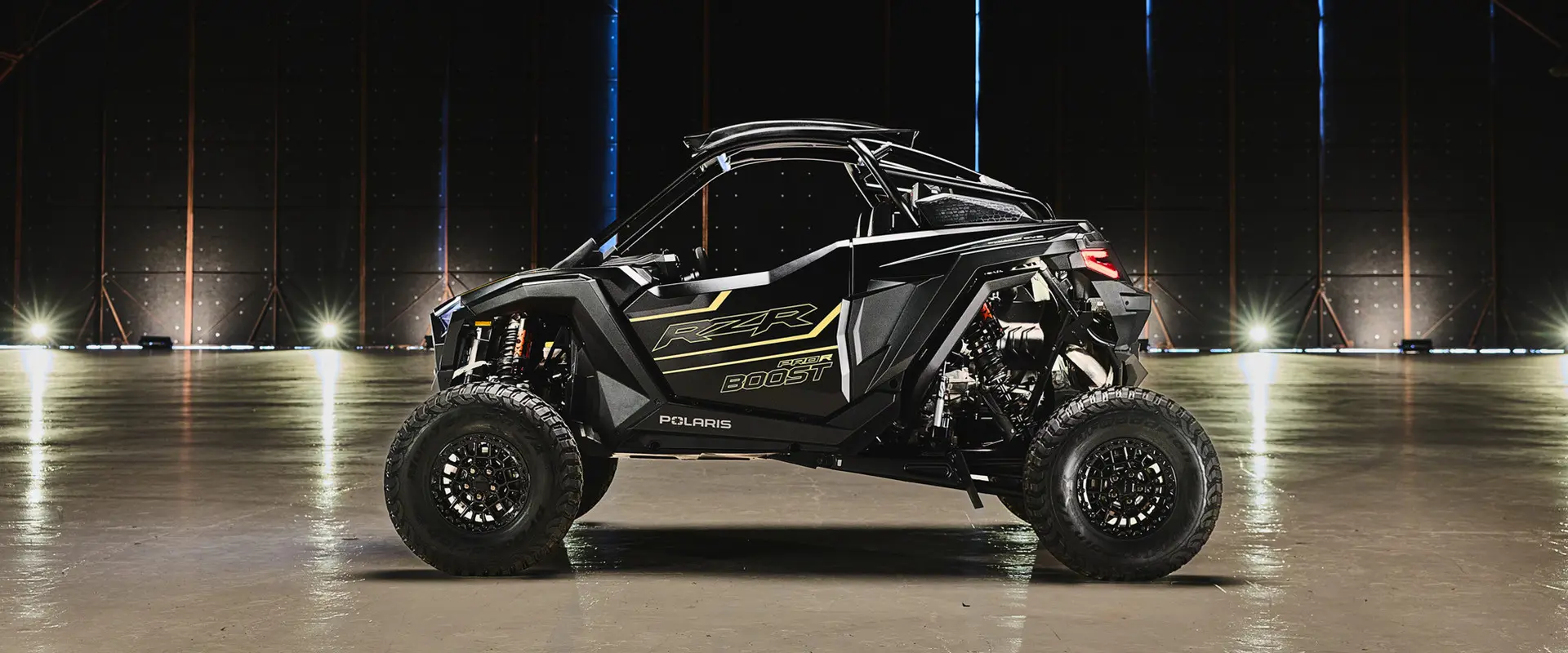 Side profile showcasing the strong stance of the 2027 Polaris RZR Pro R Boost Ultra side-by-side.