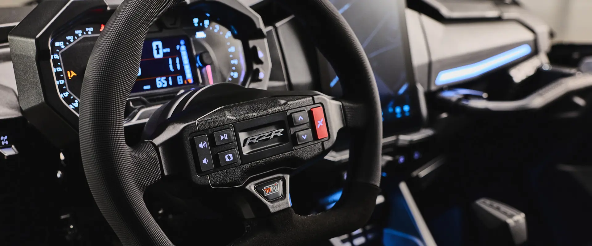 Interior view showcasing the dash and steering wheel of a 2027 Polaris RZR Pro R Boost Ultra side-by-side.