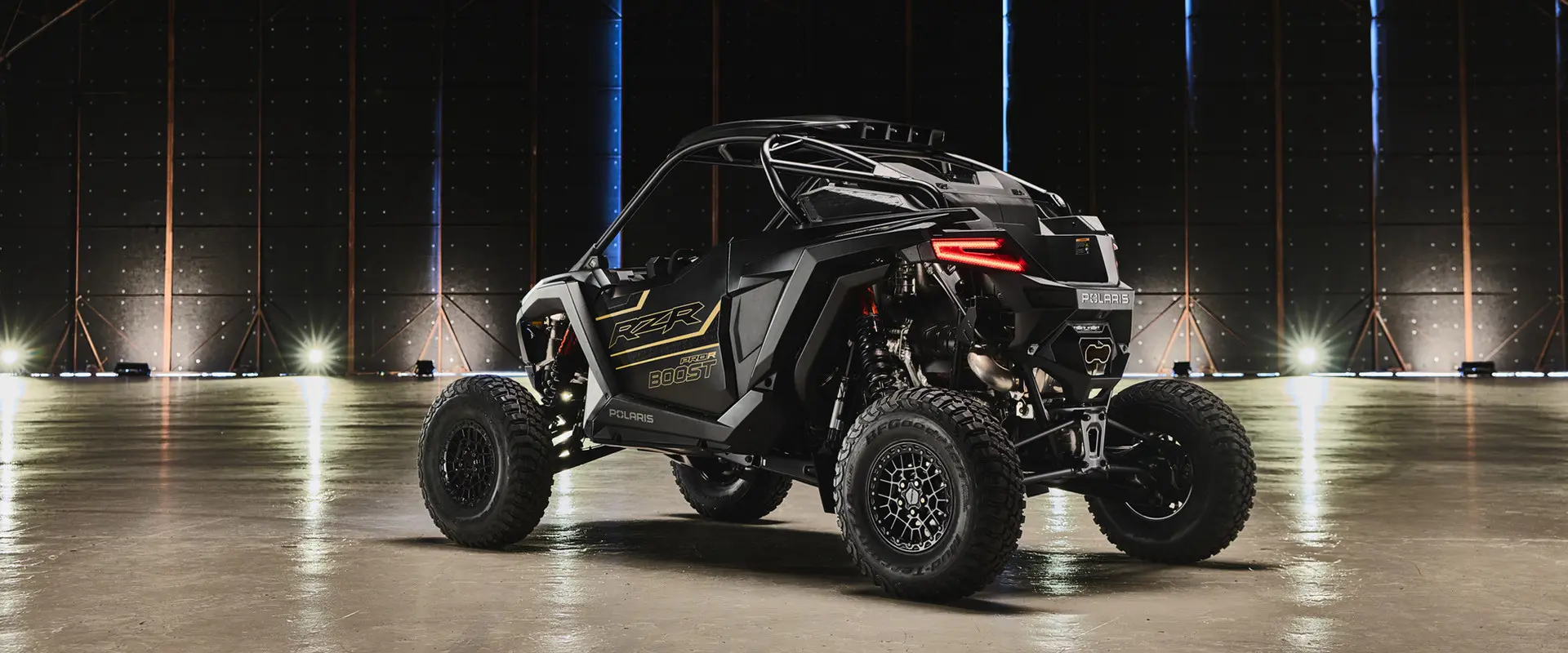 Rear-side view of a 2027 Polaris RZR Pro R Boost Ultra side-by-side.