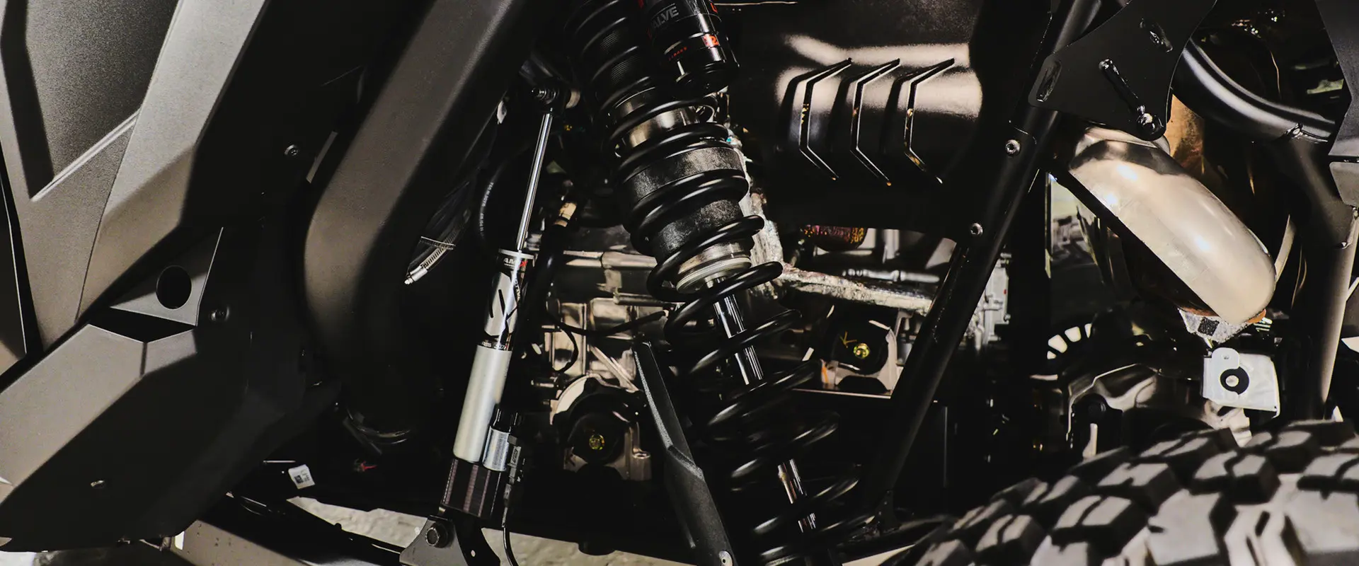 Shocks and undercarriage of a 2027 Polaris RZR Pro R Boost Ultra side-by-side.