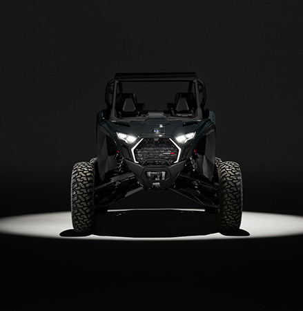 Front-end view of a 2027 Polaris RZR Pro R side-by-side showcasing the RZR Fang Lighting.