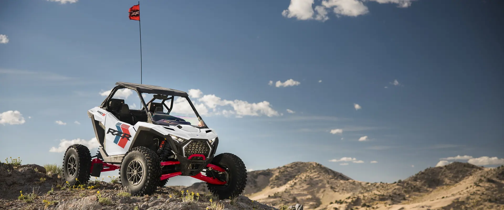 A 2027 Polaris RZR Pro S Ultimate side-by-side parked on a hill in the desert.