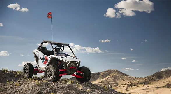 A 2027 Polaris RZR Pro S Ultimate side-by-side parked on a hill in the desert.