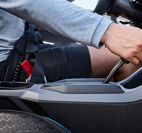 A hand on the gear selector in a 2027 Polaris RZR Pro XP side-by-side.