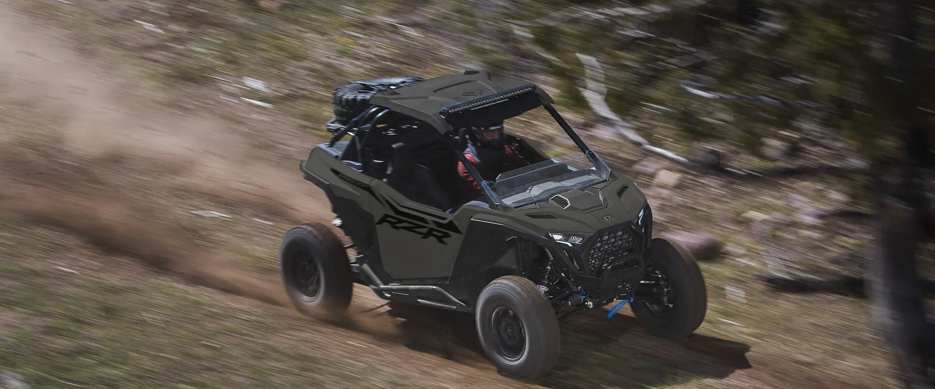 A 2027 Polaris RZR Pro XP side-by-side speeding down a trail.