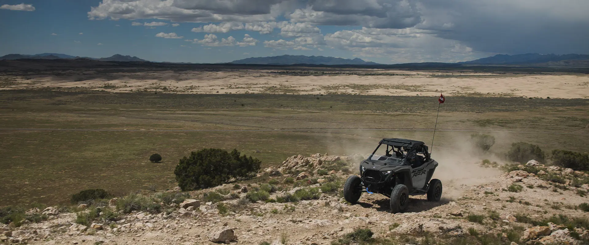 A 2027 Polaris RZR Pro XP side-by-side driving over rocky terrain.