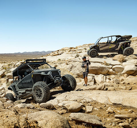 A 2027 Polaris RZR XP S 4 side-by-side crawling over rocks like a champ.