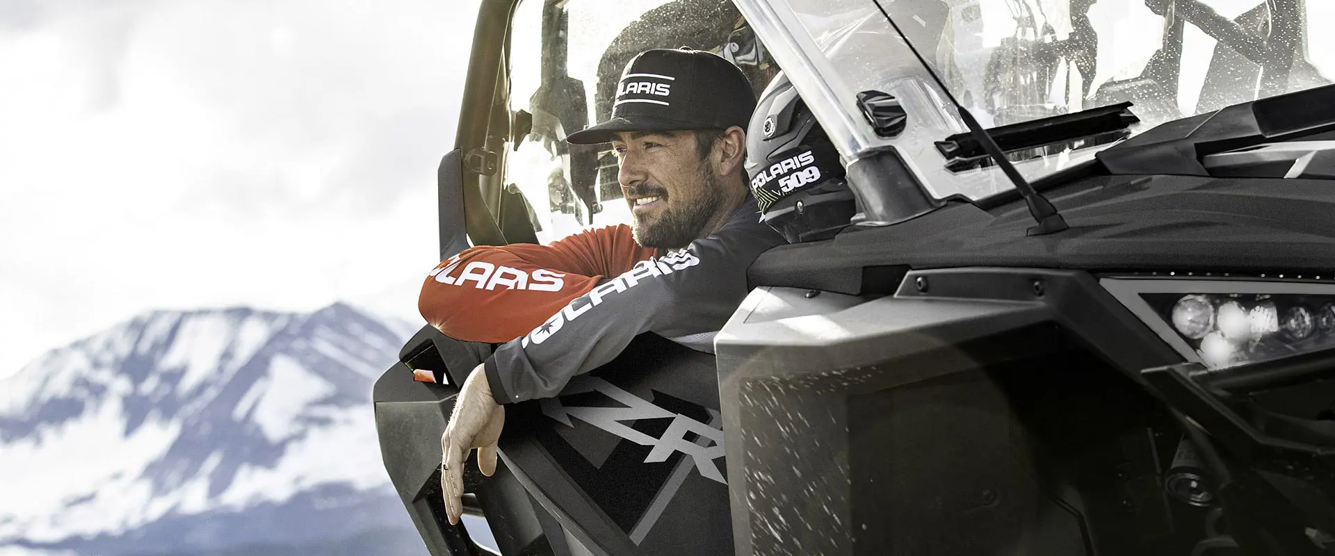 person in a polaris RZR pro xp looking out the window