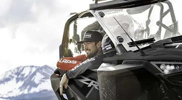 person in a polaris RZR pro xp looking out the window