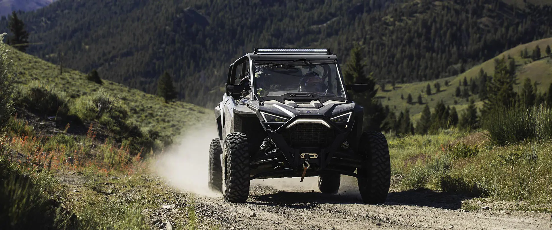 polaris rzr pro xp 4 side by side coming down a trail