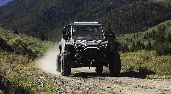 polaris rzr pro xp 4 side by side coming down a trail
