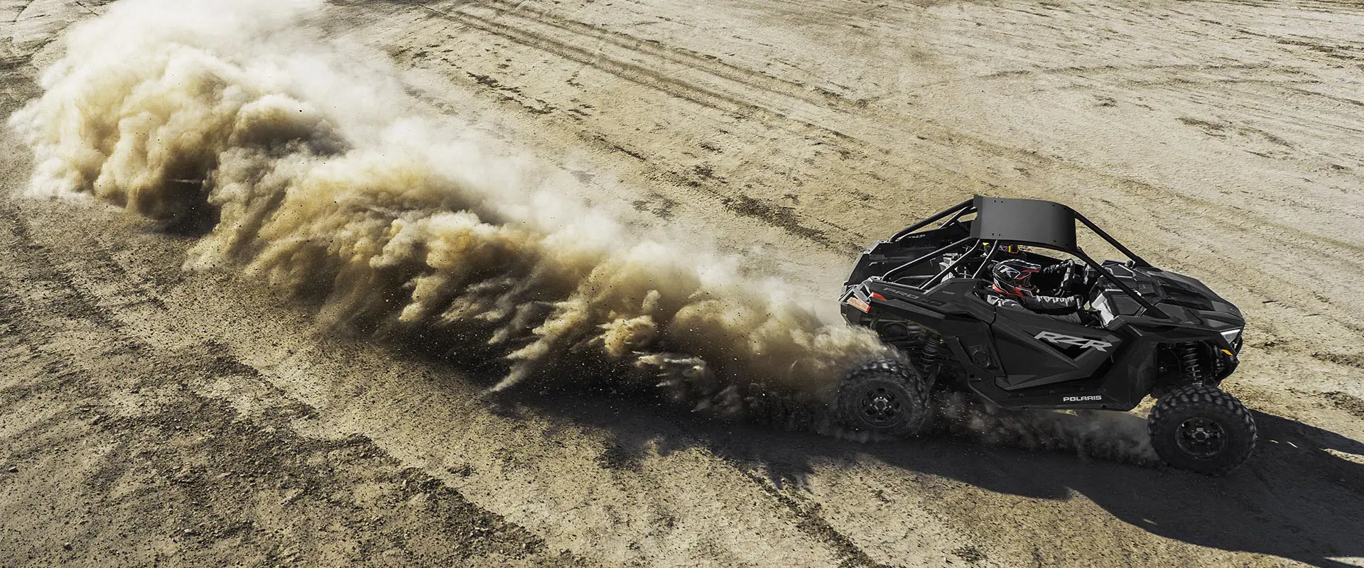 aerial view of a polaris rzr pro xp side by side in the desert
