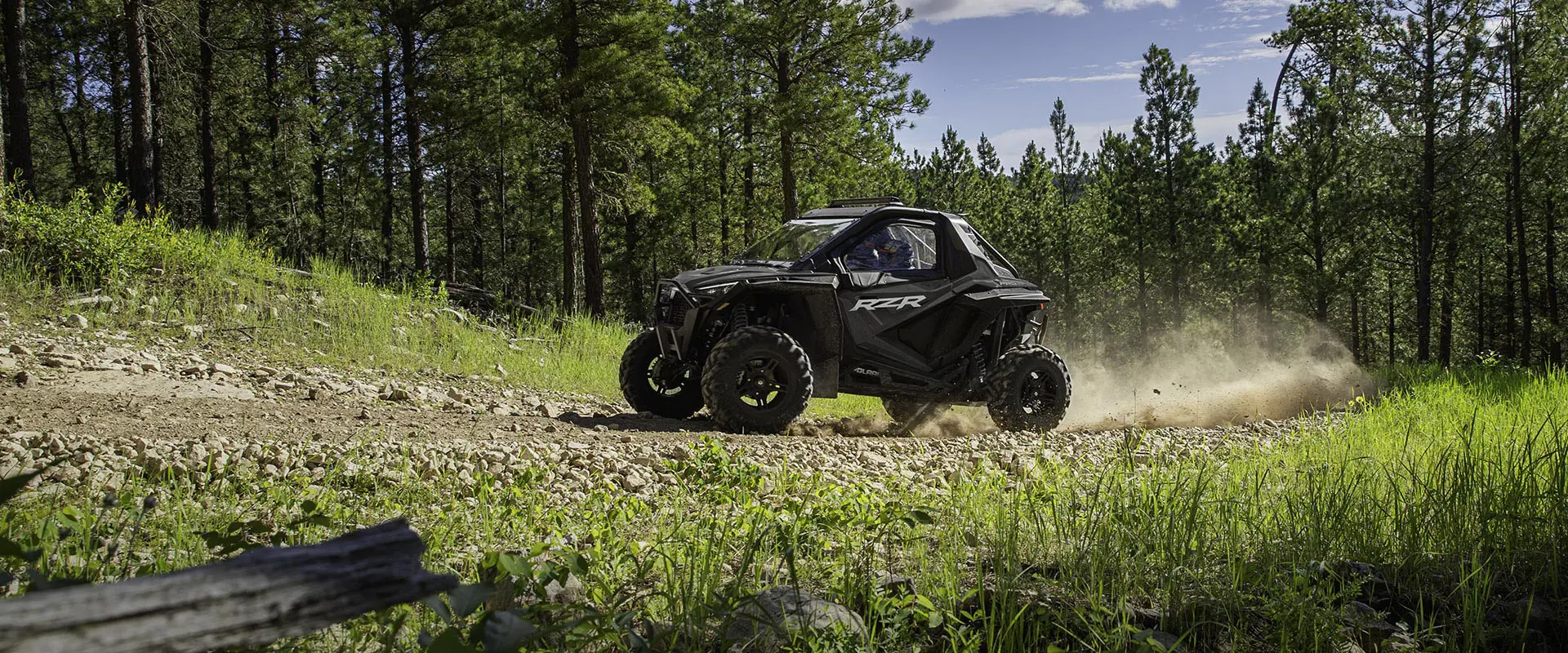 polaris rzr pro xp side by side coming up a trail