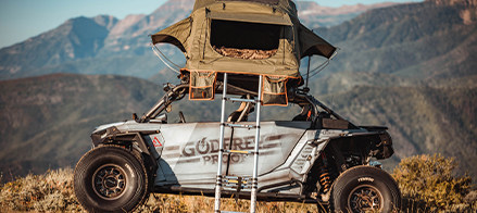 A customized RZR vehicle on the mountains