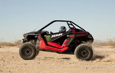 Casey cruising through the desert on his RZR