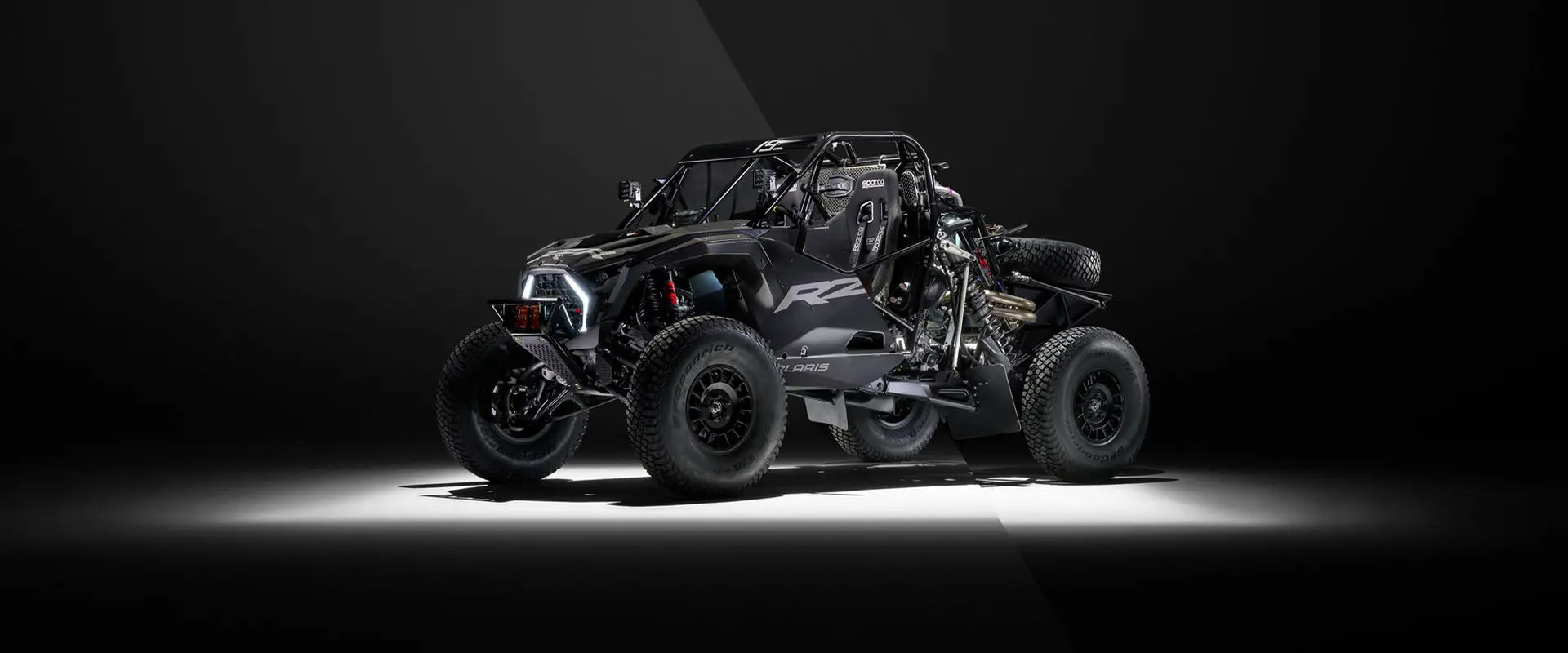 Angle view of the Polaris RZR R Factory Edition split in two showing the exterior and chassis of the vehicle.
