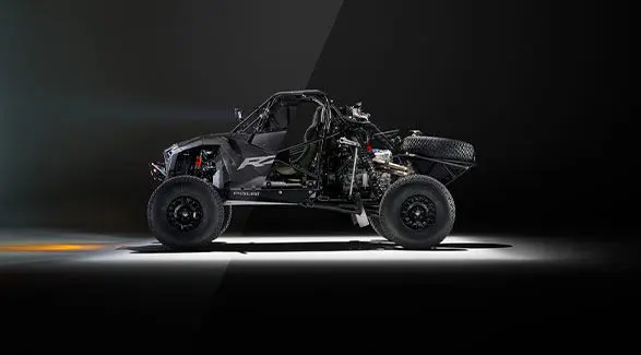 Side view of the Polaris RZR R Factory Edition split in two showing the exterior and chassis of the vehicle.