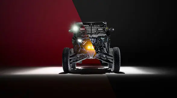 Front view of the Polaris RZR Pro R Factory Edition split in two showing the exterior and chassis of the vehicle.