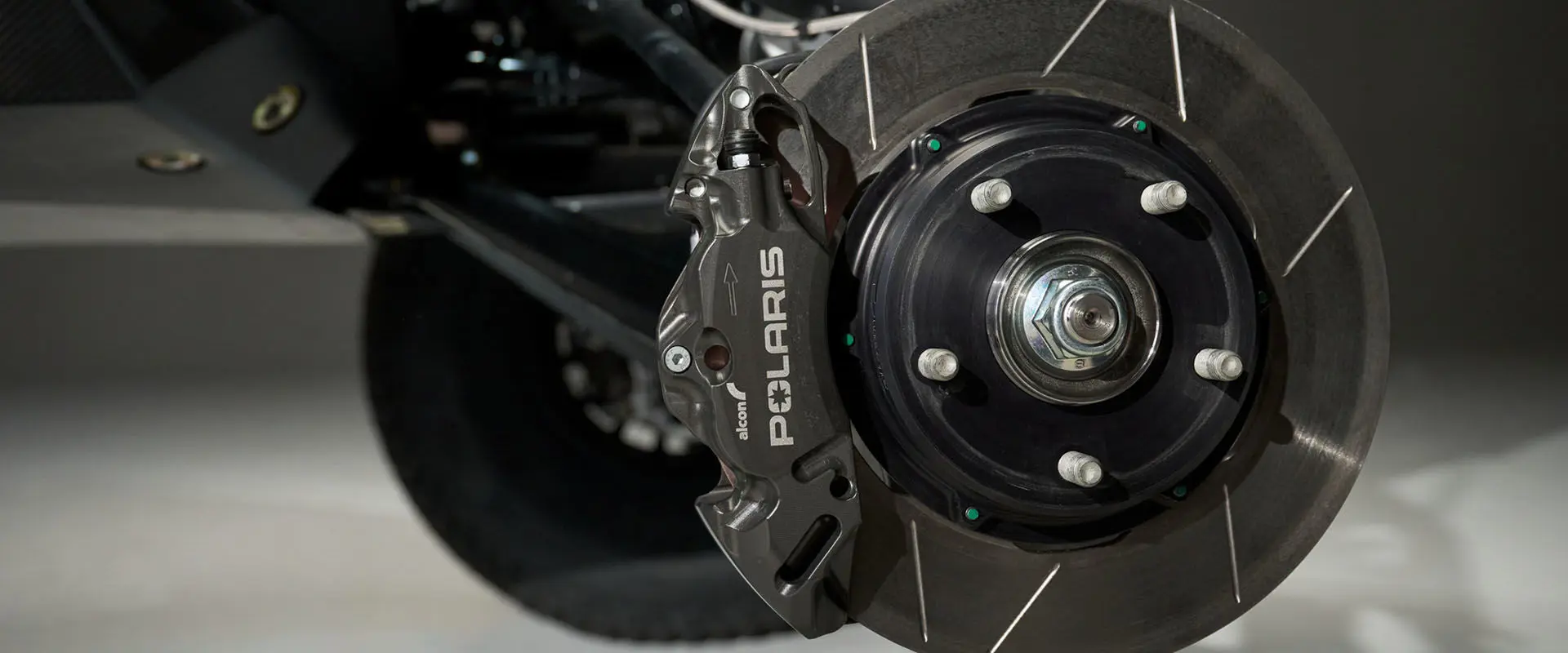 Close-up of the disc brake and pads on the Polaris RZR Pro R Factory Edition Side-by-Side.