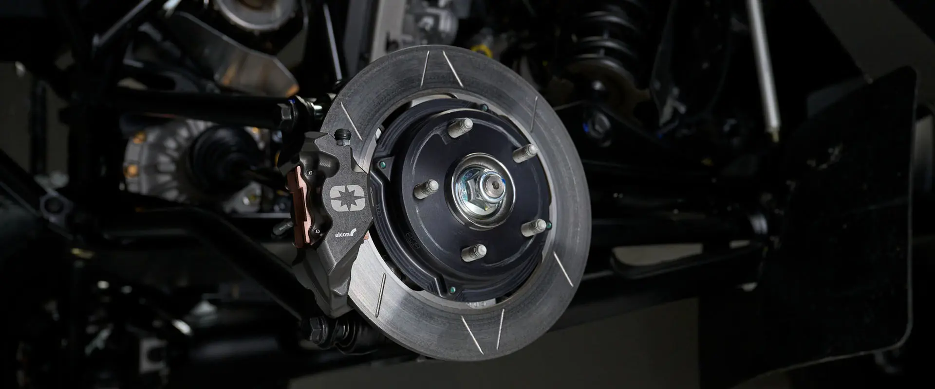 Angle close-up of the disc brake and pads on the Polaris RZR Pro R Factory Edition.