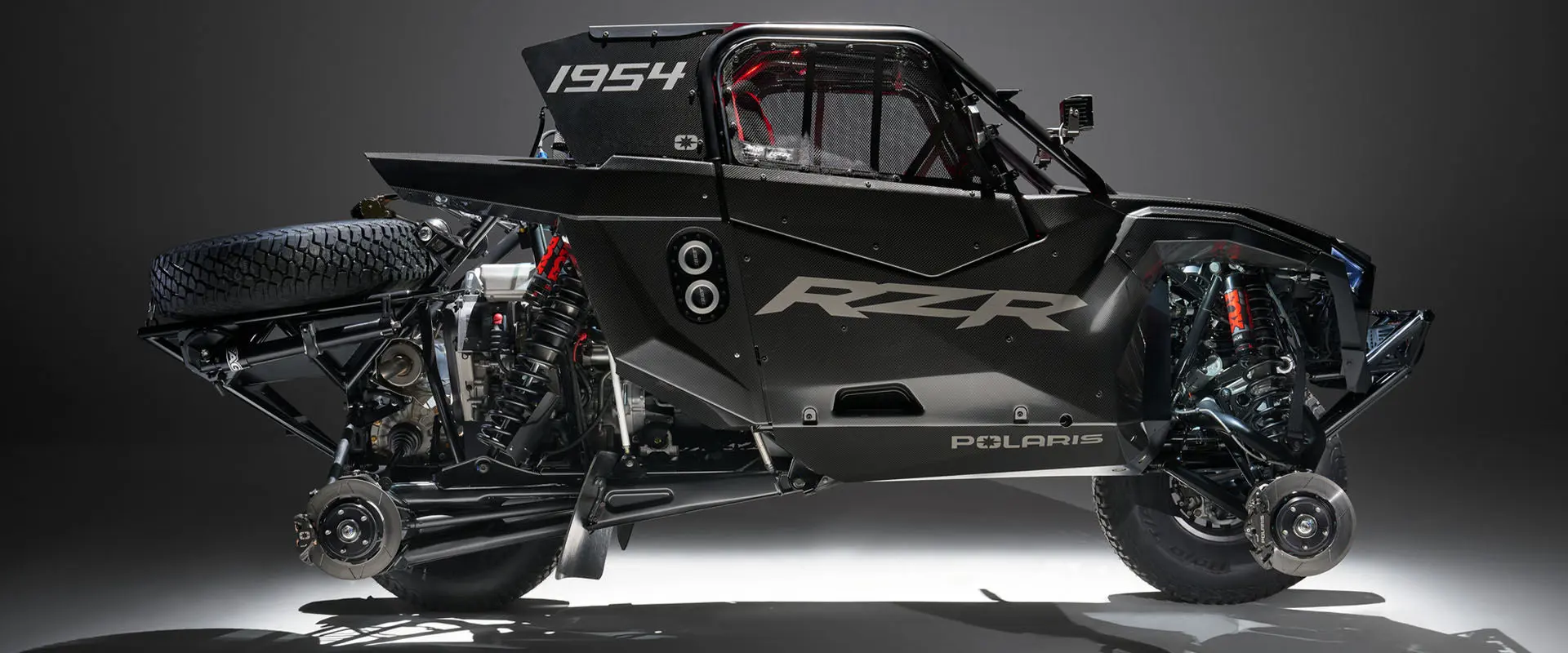 Side view of the Polaris RZR R Factory Edition showing the brake dissc and pads for two tires SxS.