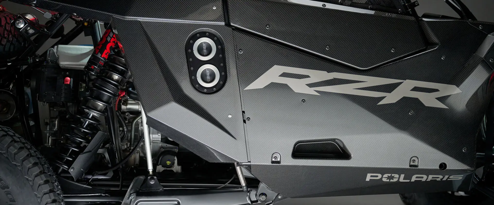 Front view of the large 130L fuel cell with an efficient dual dry brake system of the Polaris RZR Pro R Factory Edition SxS.