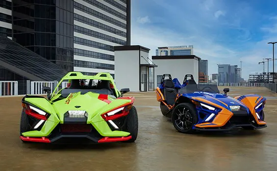 Front view of two Slingshot R vehicles parked next to each other