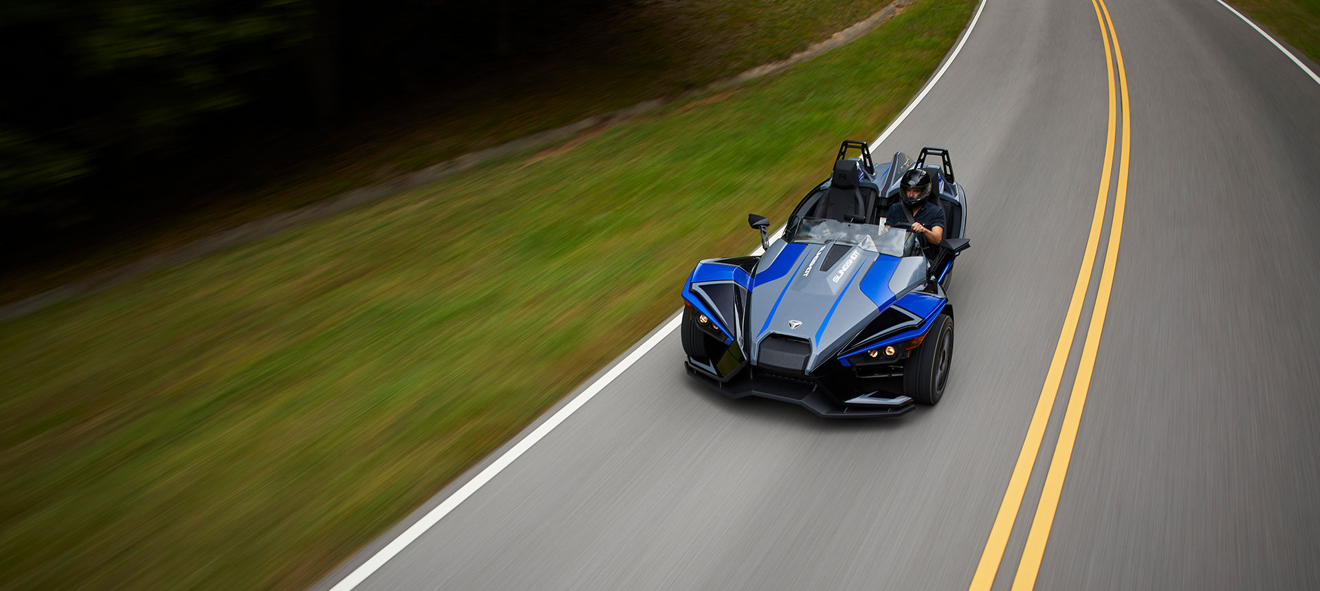 Side view of two Slingshot R vehicles parked in front of each other