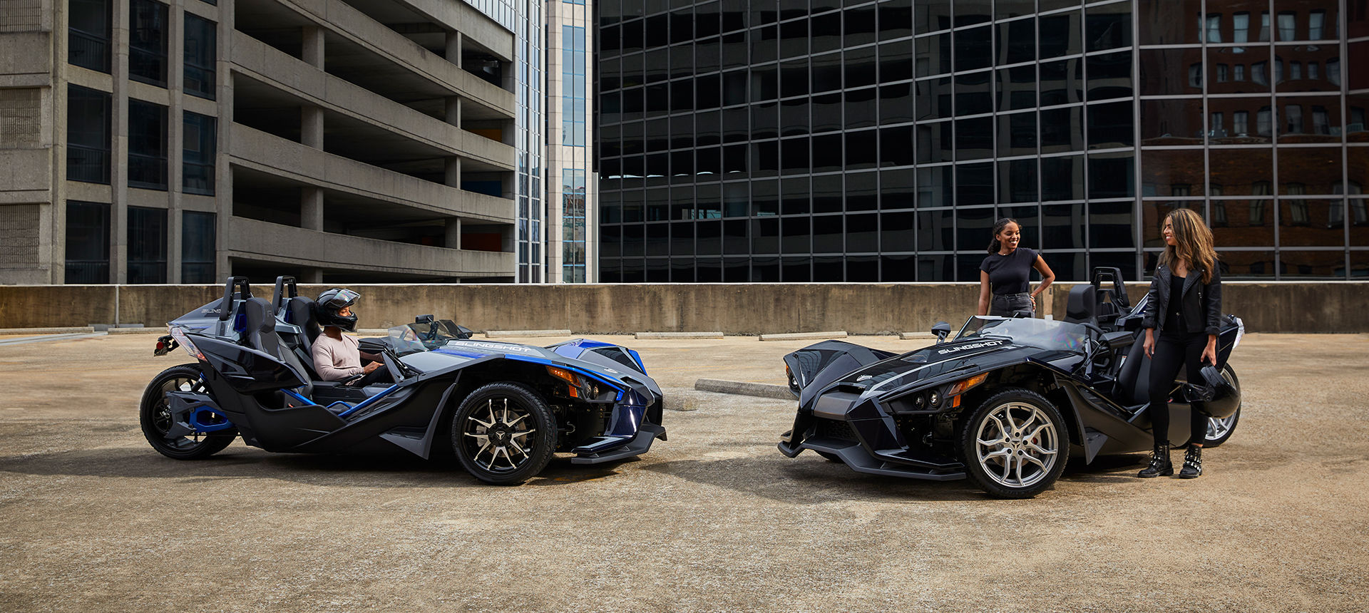 Three Slingshot vehicles riding on a road