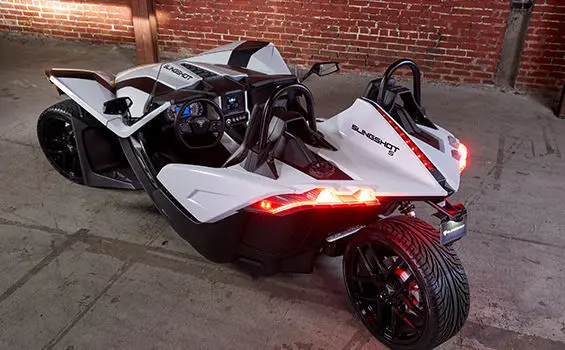 Slingshot inside a garage with lights on