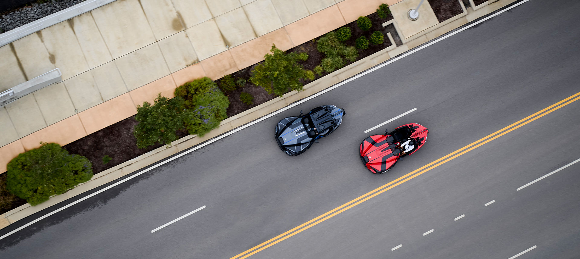 Two Slingshots running on the road