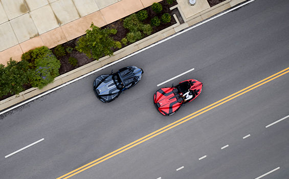 Two Slingshots running on the road