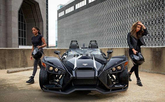 Slingshot racing in a road in the middle of the woods