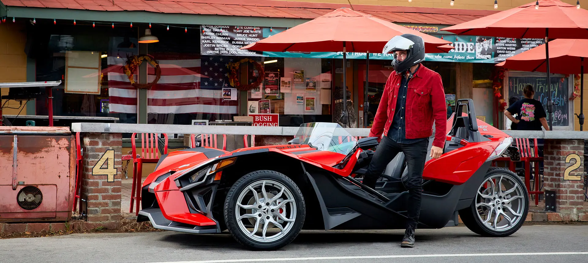 Man with his Slingshot in front of a restaurant