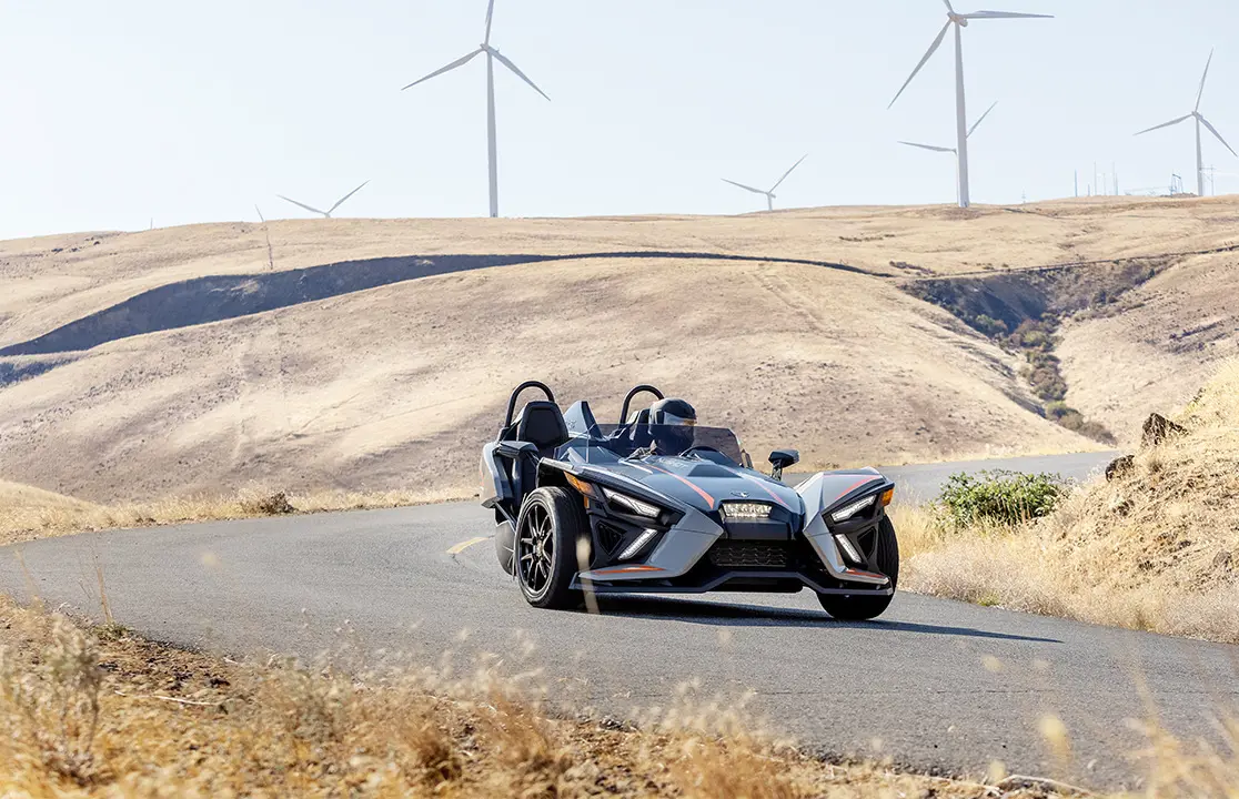 polaris slingshot slr three-wheeled motorcycle taking a sharp corner with ease