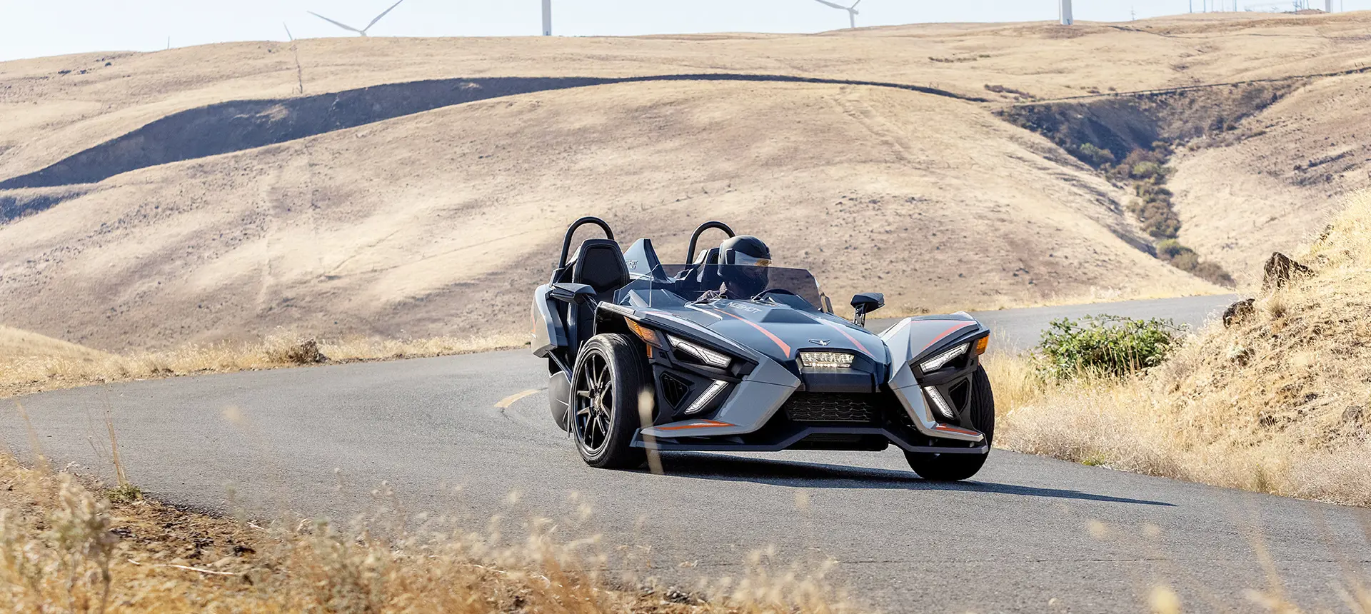 polaris slingshot slr three-wheeled motorcycle taking a sharp corner with ease