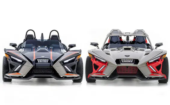 front end view of 2 polaris slingshot slr three-wheeled motorcycles side-by-side