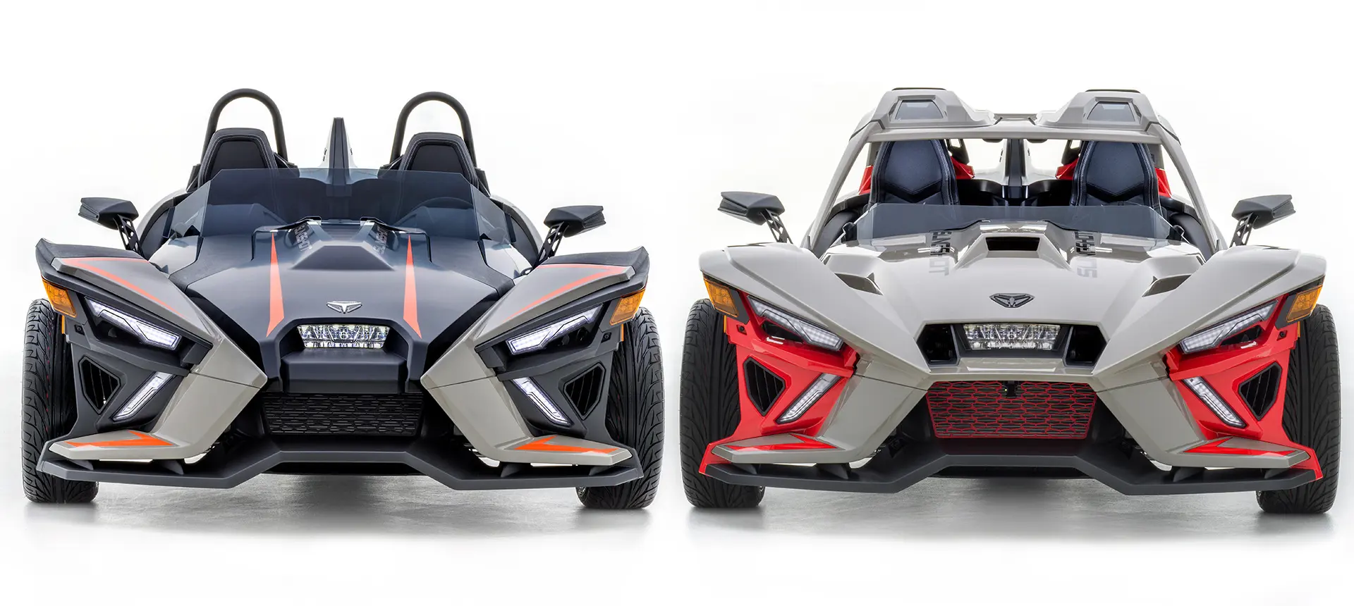 front end view of 2 polaris slingshot slr three-wheeled motorcycles side-by-side