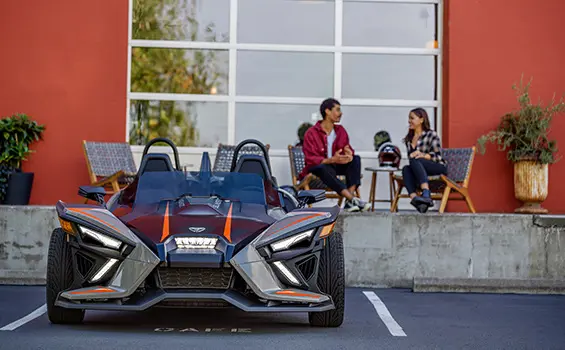 front end of a parked polaris slingshot slr three-wheeled motorcycle