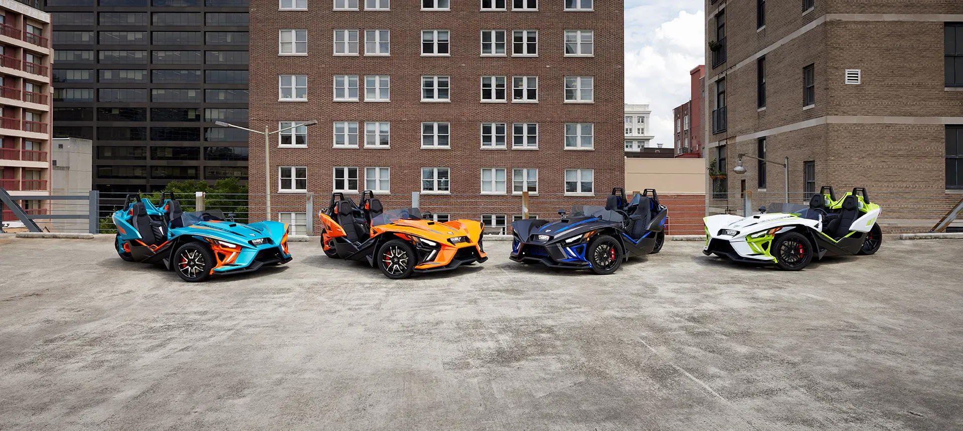 4 multi-colored polaris slingshot R three-wheeled motorcycles